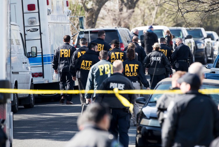 Authorities work on the scene after multiple explosions in Austin on Monday. Police are responding to another explosion Monday, that badly injured a woman, hours after a package bomb killed a teenager and wounded a woman in a different part of the city. 