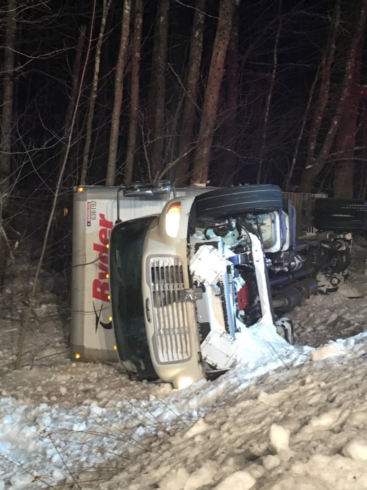 A truck carrying Amazon packages rolled over in Limington early Monday morning, spilling fuel and transmission fluid on Sokokis Trail.  
