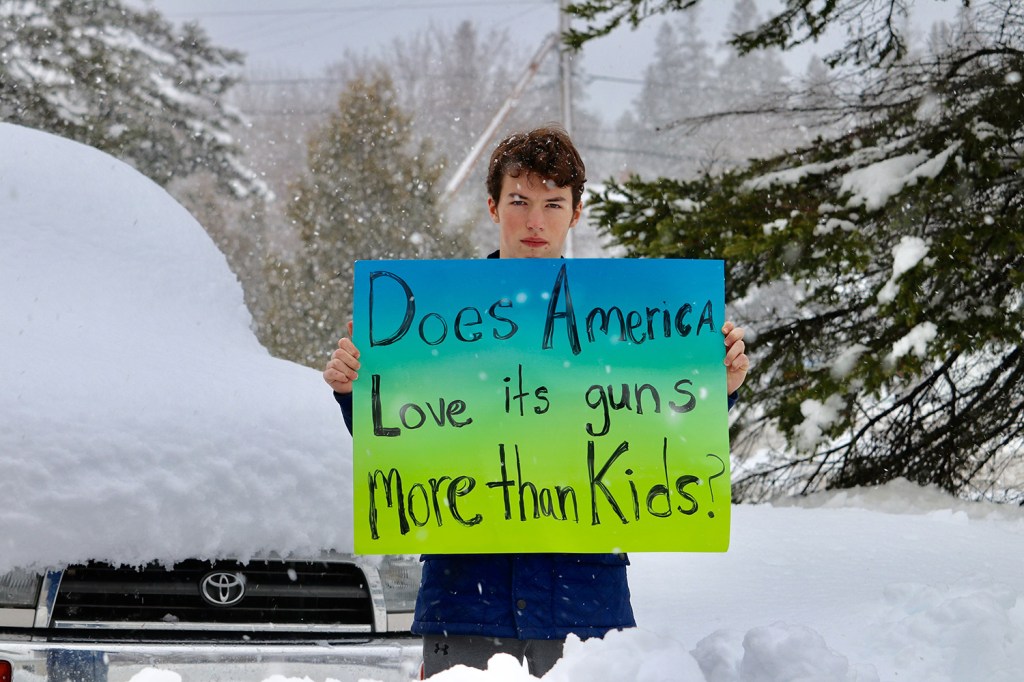 Finian Burns, a freshman at Mount Desert High School, joins a student protest against gun violence on Wednesday. The Bar Harbor school was among those in Maine whose students staged a protest even though school had been canceled for the day because of a snowstorm.