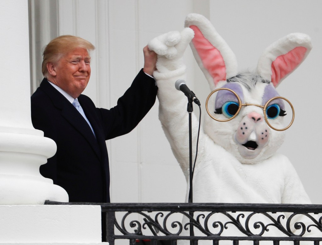 President Trump joins the Easter Bunny after speaking to the crowd on the Truman Balcony during the annual White House Easter Egg Roll on the South Lawn on Monday.