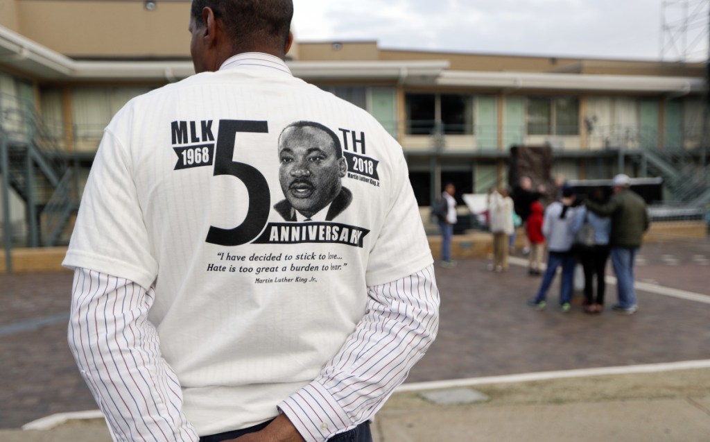 A man wears a shirt commemorating the 50th anniversary of the death of The Rev. Martin Luther King Jr. outside the National Civil Rights Museum on Monday. King was assassinated April 4, 1968.