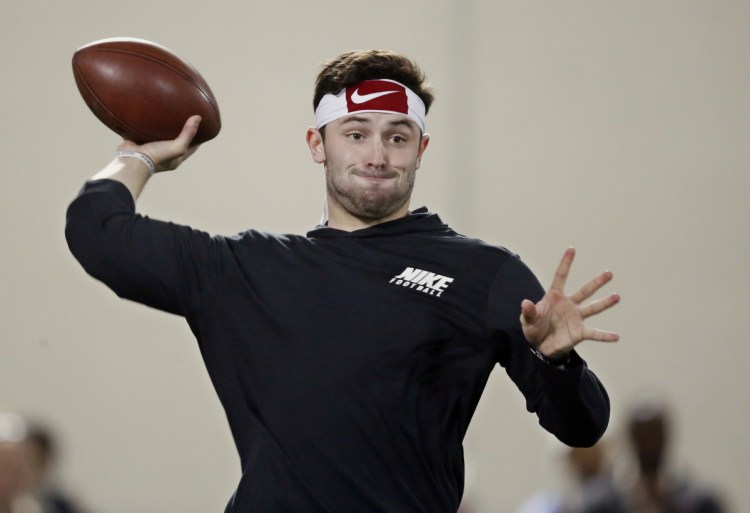Oklahoma quarterback Baker Mayfield passes during a Pro Day workout in Norman, Oklahoma, in March. Mayfield is projected to be one of the first quarterbacks selected in the 2018 NFL draft. (AP Photo/Sue Ogrocki)