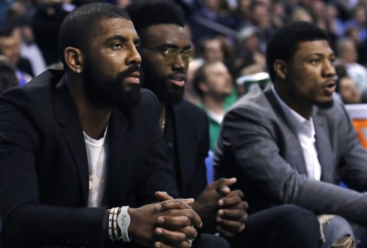 Boston Celtics guard Kyrie Irving, left, will miss the rest of the season. He faces surgery to remove two screws from his left knee.