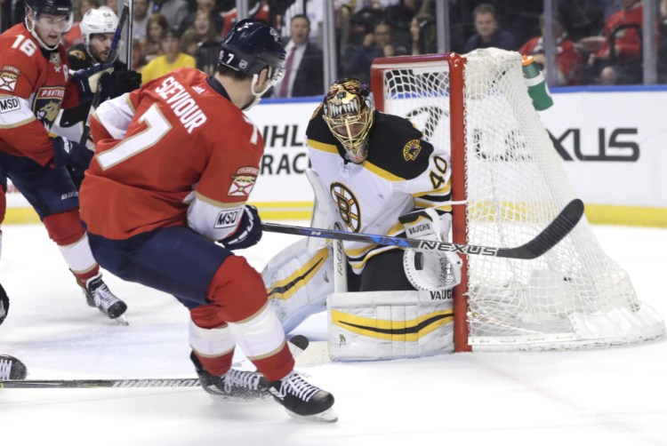 Bruins goaltender Tuukka Rask makes a save on Florida's Colton Sceviour during the second period Thursday night in Sunrise, Fla. The Panthers won 3-2.