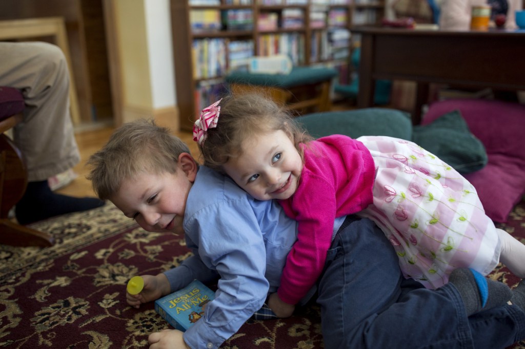 Paisley, 2, plays around with Quentin, 4, who was also adopted by the DeWicks in Rockport. Paisley was placed with the DeWicks through foster care at 12 days old. 