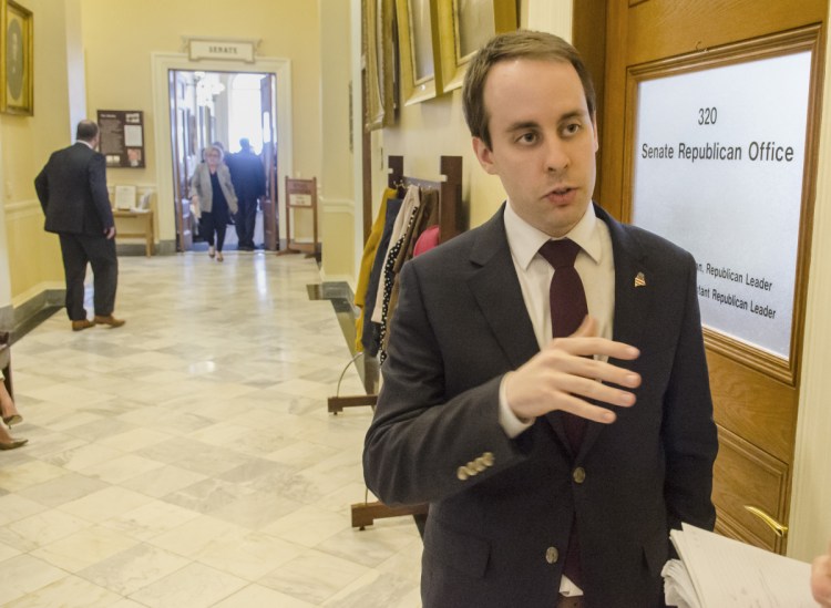 AUGUSTA, ME - APRIL 10: Sen. Eric Brakey, R-Auburn, talks to reporters in the hallway on Tuesday April 10, 2018 at the Maine State House in Augusta. (Staff photo by Joe Phelan/Staff Photographer)