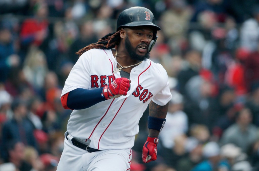 Boston's Hanley Ramirez runs on his two-run double during the fourth inning of Saturday's game against Baltimore in Boston. The Red Sox won, 10-3.