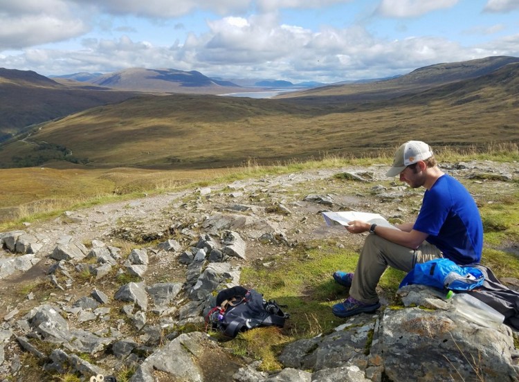 Ryan Linn grew up in Belfast, went to Vassar College and now lives in Portland, but he has also seen his share of the world. Shown here, he stops along a trail in Scotland to check his map in September.