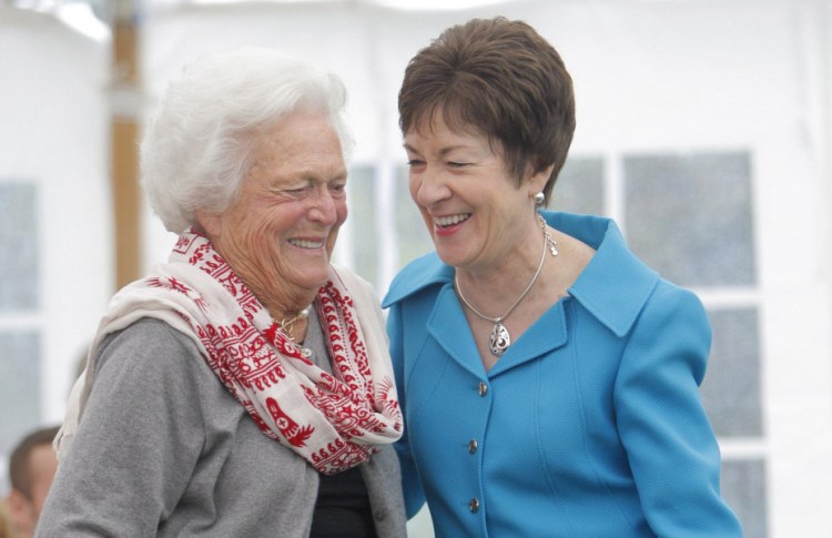 Barbara Bush and U.S. Sen. Susan Collins, R-Maine, share a laugh after the senator spoke at a dedication ceremony for a garden honoring Barbara Bush at the town green in Kennebunkport on Sept. 29, 2011.