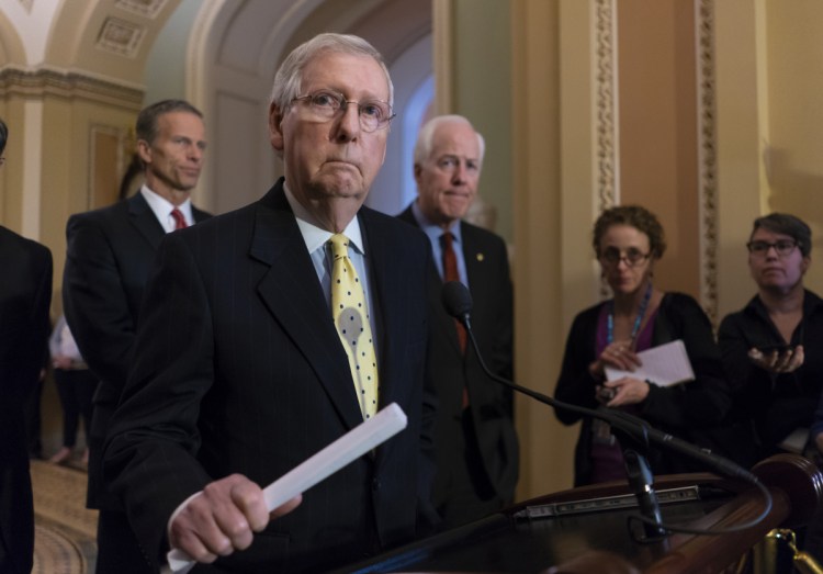 Sen. Mitch McConnell, R-Ky., joined from left by Sen. John Thune, R-S.D., and Majority Whip John Cornyn, R-Texas on Tuesday at the Capitol.