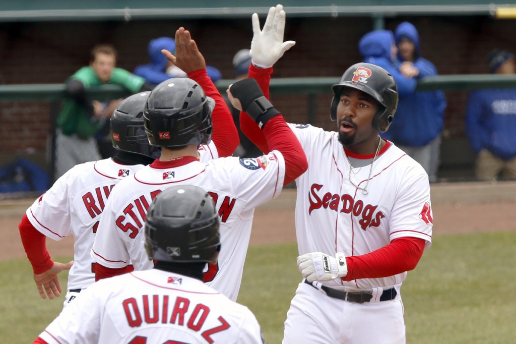 After Bobby Poyner got the Sea Dogs started with a scoreless inning Thursday, Josh Ockimey, right, delivered a grand slam and led Portland to a 5-0 victory against Hartford. Story, C3