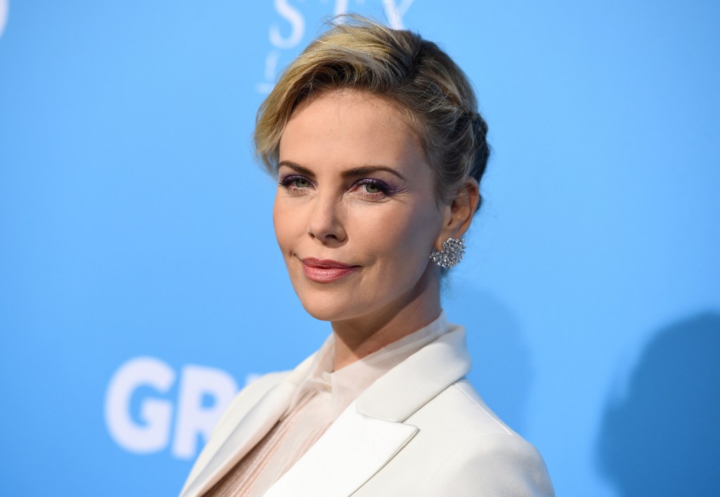 South African-born actress Charlize Theron says the media exaggerated her quotes about worrying for her childrens' safety published in Elle magazine.