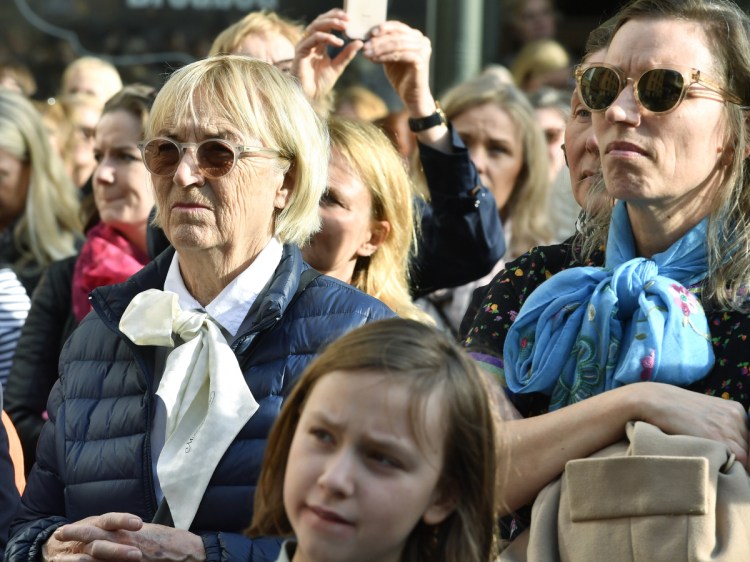 People gather outside the headquarters of the Swedish Academy in Stockholm to demand all of its remaining members resign Thursday.