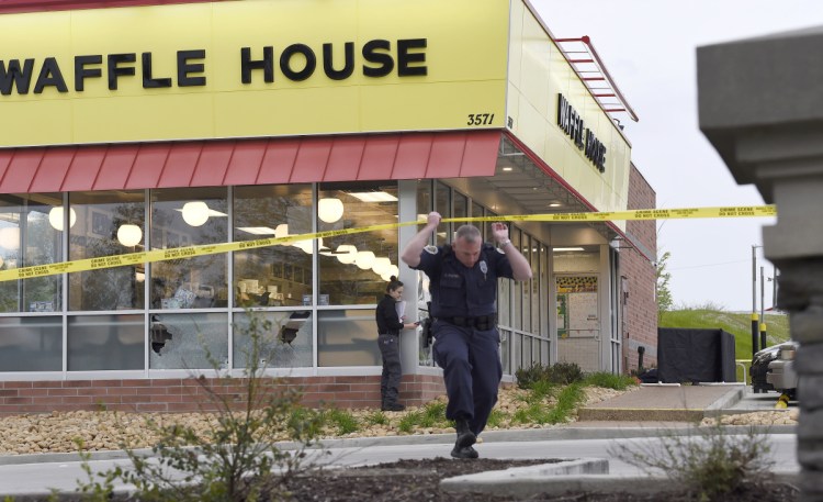 Police work the scene of a fatal shooting at a Waffle House in the Antioch neighborhood of Nashville on Sunday.