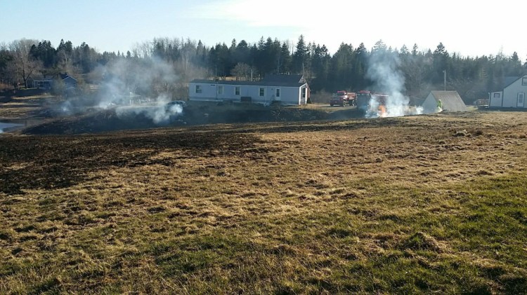 The photograph of the smoldering fields caused by a brush fire Monday was taken by the Maine Forest Service in Machiasport. The brush fire burned between 6 and 8 acres.