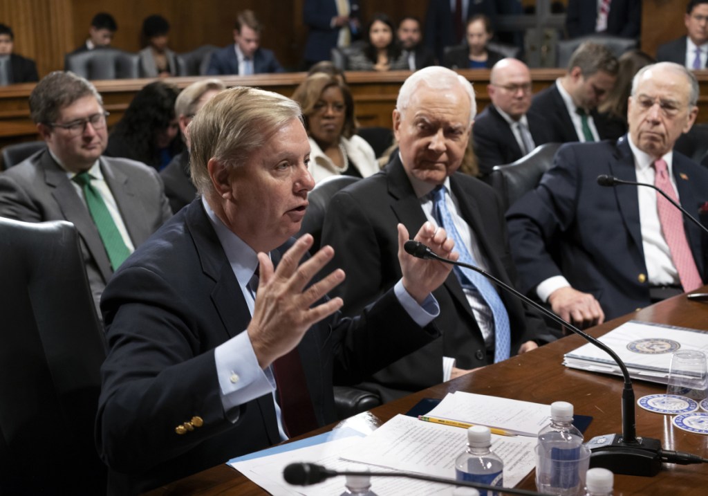 From left, Sen. Lindsey Graham, R-S.C., Sen. Orrin Hatch, R-Utah, and Senate Judiciary Committee Chairman Chuck Grassley, R-Iowa, continue discussions after the panel voted 14 to 7 to protect Special Counsel Robert Mueller and to send the Special Counsel Independence and Integrity Act to the full Senate, on Capitol Hill in Washington, on Thursday.