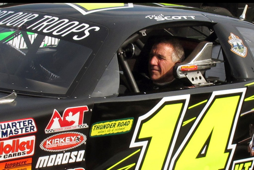 Vermont Gov. Phil Scott waits to start a practice run at a Barre racetrack last year. He's wondering if he should race this year, after signing legislation that disappointed race crowds.
