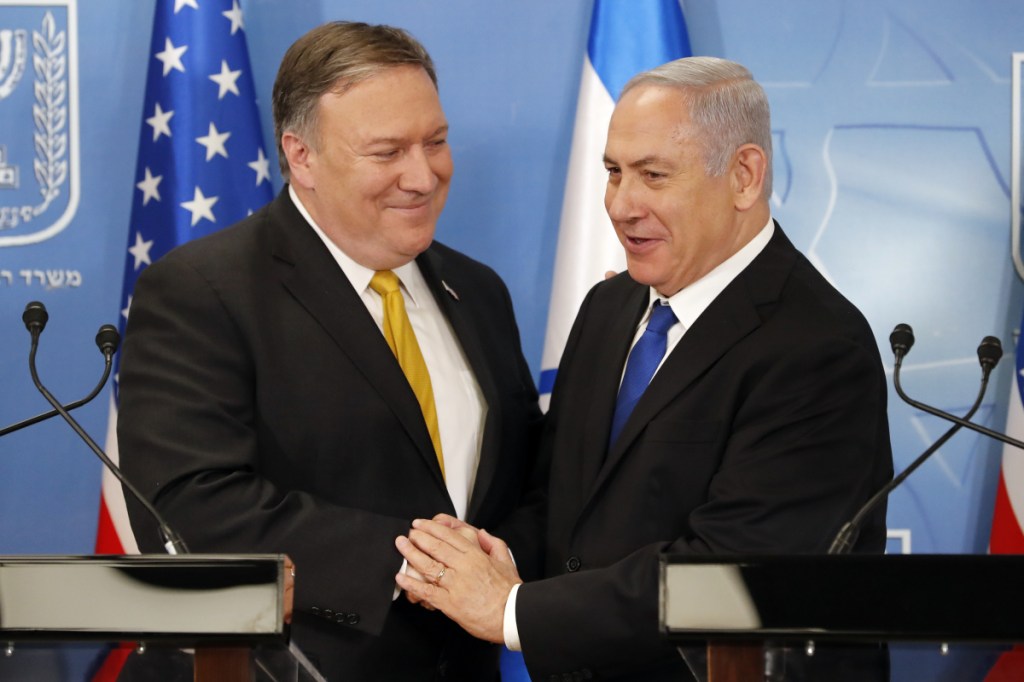Secretary of State Mike Pompeo, left, is greeted by Israeli Prime Minister Benjamin Netanyahu ahead of a news conference at the Ministry of Defense in Tel Aviv on Sunday.