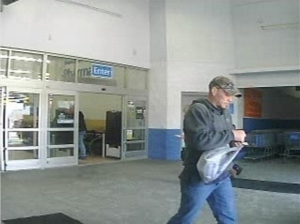 A Walmart a security camera photo shows a man suspected of stealing a phone from a home in China and trying to return to it the Augusta store.
