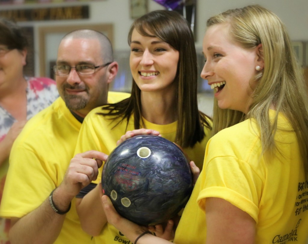New Balance employees, from left, Matt LeBlanc, Alisha Whittemore and Ashley Dodge supported their bowling team and local youth at last year's Big Brothers Big Sisters of Mid-Maine Bowl for Kids' Sake event in Skowhegan. This year's event is May 2-10 in Skowhegan, Augusta and Hallowell.