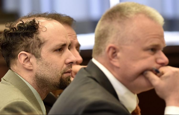 Defendant Luc Tieman, left, and his attorney, Stephen Smith, listen to testimony Monday, the first day of trial in the death of Valerie Tieman, in Somerset Superior Court in Skowhegan.