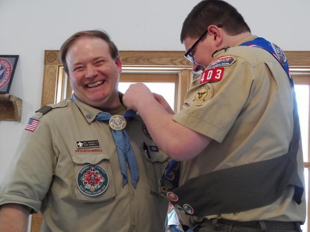 Tyler Ringer presents the Mentor Pin to Dave Daigneault during the ceremony and thanked Daigneault for being there for him throughout his Scouting career.