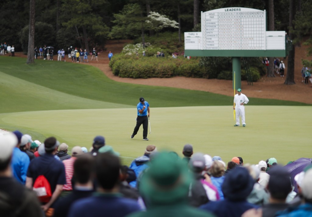 Patrick Reed celebrates his birdie on the 10th hole during the third round at the Masters on Saturday in Augusta, Georgia.