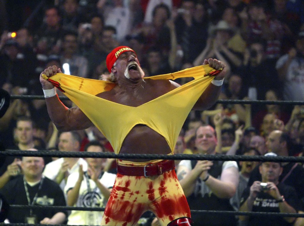 In this April 3, 2005 photo, Hulk Hogan fires up the crowd between matches during WrestleMania 21 in Los Angeles. In an ever-changing world, professional wrestling's signature event provides a needed constant, Dave Dyer writes.