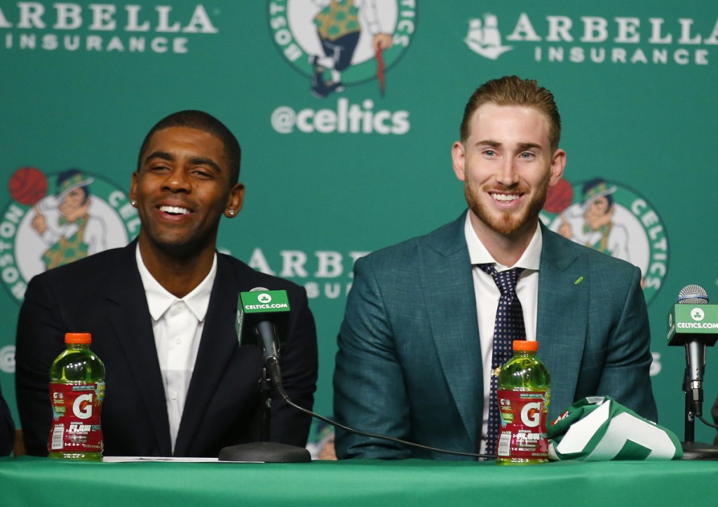 Boston's Kyrie Irving, left, and Gordon Hayward laugh during a news conference in September in Boston. Both players are injured and out for the rest of the season.