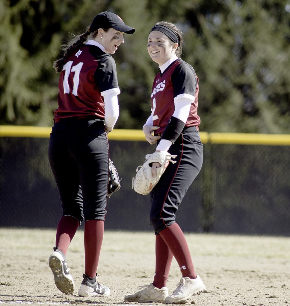 Sun Journal photo by Daryn Slover 
 Bates College pitcher Kirsten Pelletier, right, talks with shortstop Tori Fitzgerald during the first game of Saturday's doubleheader against Tufts in Lewiston.
