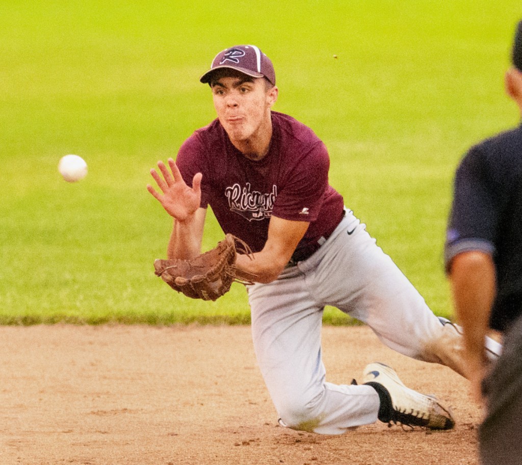 Staying focused: Richmond shortstop Zach Small dives for the ball during a game gainst Searsport in the Class D South regional final last season at St. Joseph's College in Standish.