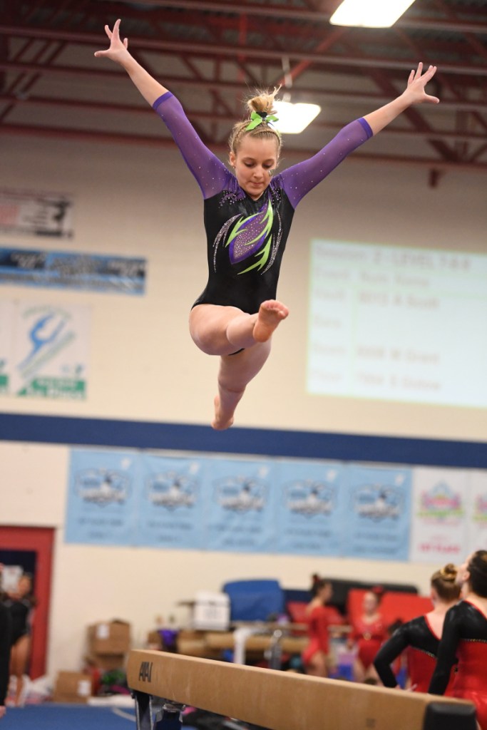 Erin Fontaine performs a routine on the bar.