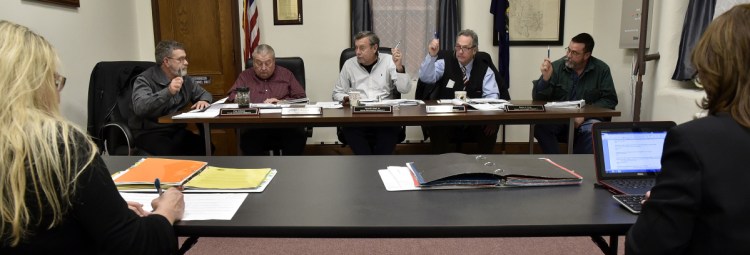 Somerset County Commissioners vote during a meeting in Skowhegan on Jan. 3, 2017. From left are Cyprien Johnson, Lloyd Trafton, Chairman Newell Graf Jr., Robert Sezak and Dean Cray. Commisioners will take up next year's budget proposal on Wednesday.