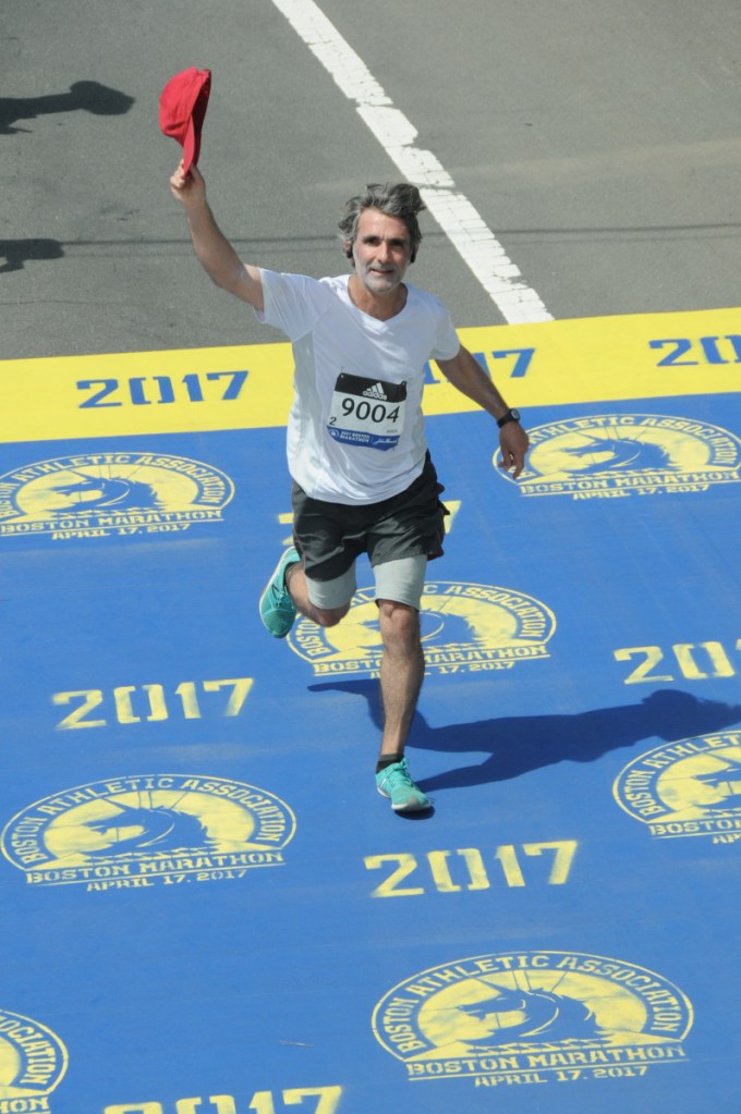 Alain Ollier, a substitute French teacher at Gardiner Area High School, completes the Boston Marathon last year. A native of Paris, France, now living in Newcastle in Maine's mid-coast, will make a second straight Boston Marathon start on Monday.