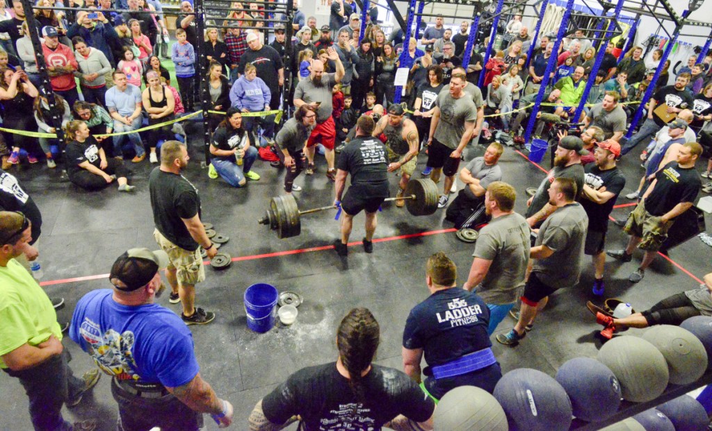 Jacob Prior lifts the barbell on his way to winning the men's heavyweight class of the last man standing deadlift Saturday at the Central Maine Strongman contest in Augusta.