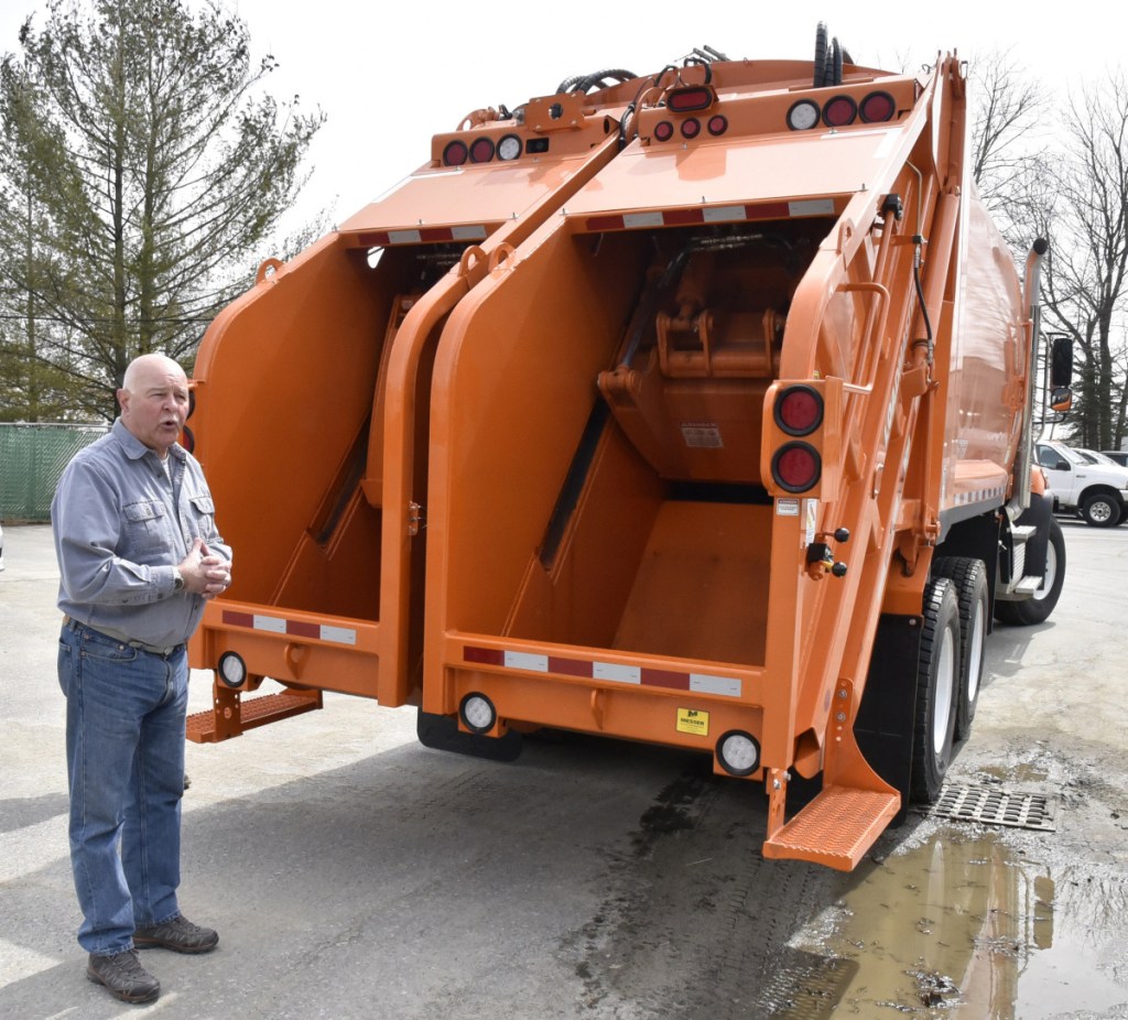 Mark Tuner, director of the Waterville Public Works department, talks about the new dual chamber packer truck that will be used to collect trash and recyclable materials in separate sections of the truck on Tuesday.