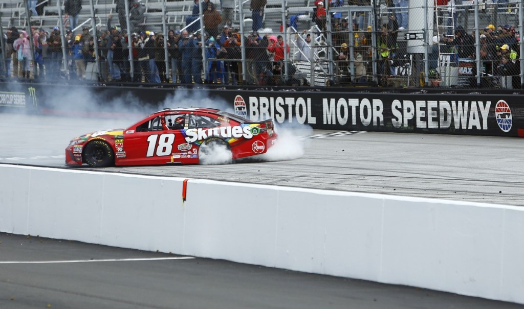 Kyle Busch does a burnout after winning during a NASCAR Cup Series race Monday in Bristol, Tennessee.
