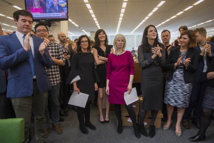 Rebecca Corbett, center in magenta dress, assistant managing editor of The New York Times and a former Morning Sentinel editor, stands amid Times staff Monday as they applaud the announcement that she and two reporters to her right, Megan Twohey and Jodi Kantor, have won the Pulitzer Prize for Public Service, chronicling the decades of sexual harassment perpetrated by Harvey Weinstein and other powerful men and helping to ignite the #MeToo movement.