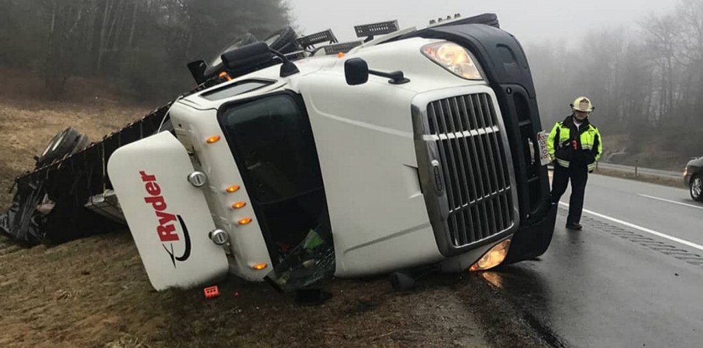 A tractor-trailer rolled off Interstate 95's northbound lanes Tuesday in Augusta, and the recovery effort blocked a lane of traffic.