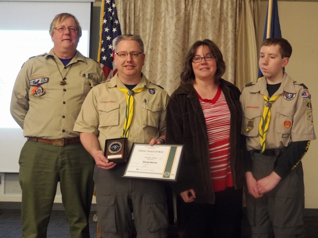 Joe Shelton received the District Award of Merit at the Boy Scout District Dinner on April 7 at the Waterville Lodge of Elks. From left are Kennebec Valley District Chairman Bruce Rueger, Joe Shelton, Terry Shelton and Nick Shelton. Joe was one of two to receive the highest honor a local district of Scouting can present to a volunteer leader. The second will be presented at a later date.