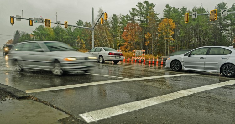 Vehicles drive through the intersection of Civic Center Drive and Darin Drive on Nov. 3, 2016. in Augusta. A proposed sidewalk would be sited on the southern side of Civic Center Drive, from Darin Drive to Townsend Road, an area that includes access roads to hotels and other businesses, the Augusta Civic Center, and the Marketplace at Augusta shopping center.