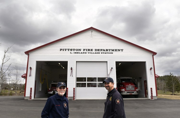 Larry Ireland, left, and Chief Jason Farris stand outside the new East Pittston Fire Station on Thursday. The building was named after Ireland, a longtime volunteer with the company.
