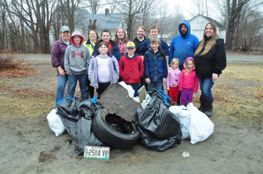 Members of New Sharon Girl Scout Troop 212 and friends and families collected several bags of trash along the town's roads on April 17, as an Earth Day project. The event was sponsored by the New Sharon Community Improvement Team. Front, from left, are Kaden Allen, Lily Ayer, Aiden Ayer, Joey Rackliff, Emmah-Jean Emery, Miah Emery and Jennifer Rackliff. Back, from left are Wendy Pond of the CIT, Karen Ayer, Nicholas Rackliff, Megan Rackliff, Lorna Ayer, Sam Rackliff and Warren Taylor.