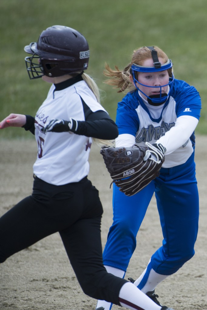 Maine Central Institute's Josie Libby, left, avoids the tag from Lawrence second baseman Sarah Poli on Friday in Fairfield.