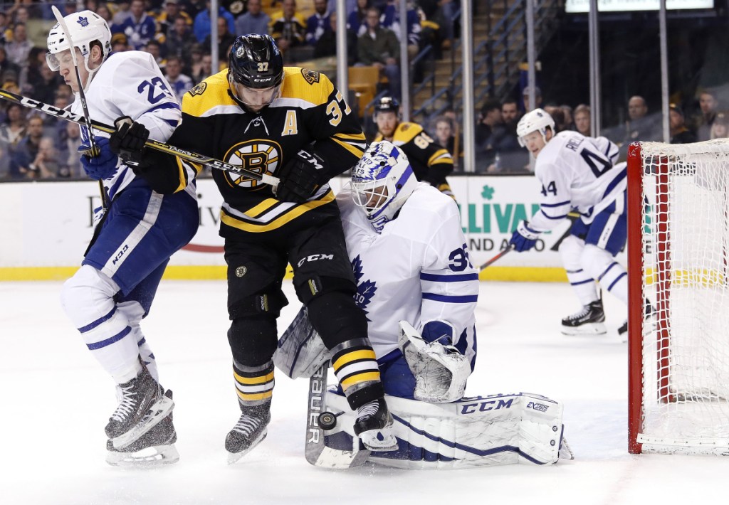 Boston Bruins' forward Patrice Bergeron, center, may be back on the ice for Game 5 against the Toronto Maple Leafs on Saturday night.