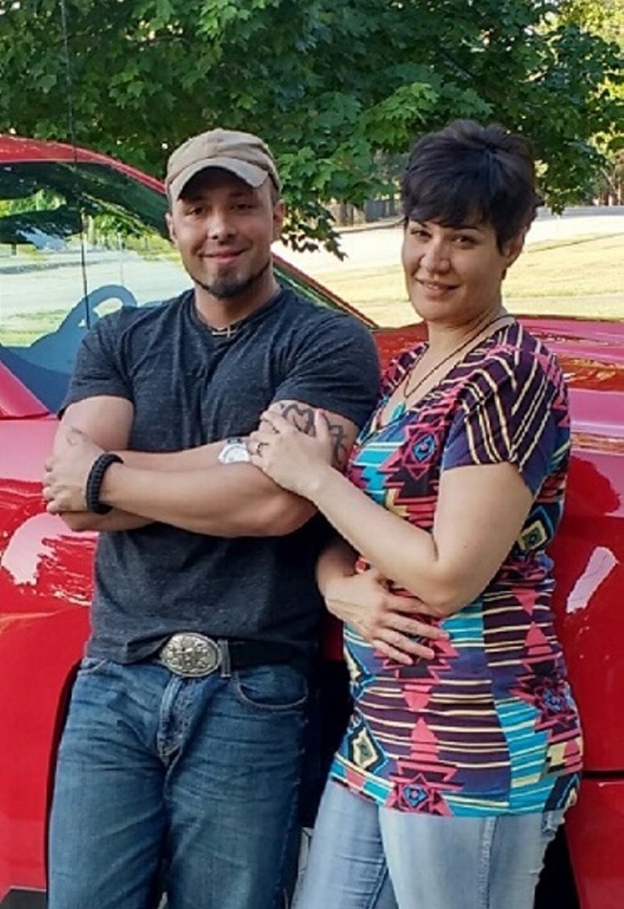 Valerie Tieman, left, is seen with her husband, Luc, in this July photo provided by police. Behind them is the truck she was last seen in Aug. 30, 2016, at a Walmart parking lot in Skowhegan.