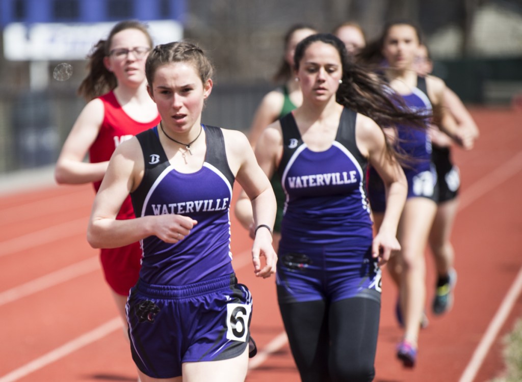 Waterville's Gwinna Remillard, foreground, competes in the 1,600 meters with teammate Rebecca Beringer, back right, at the Waterville Relays on Saturday in Waterville.