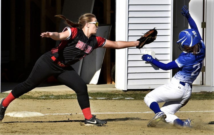 Madison runner Jordyn Wheeler slides into third base as Hall-Dale's Bella Marino tries to apply the tag during a Mountain Valley Conference game Monday in Farmingdale.