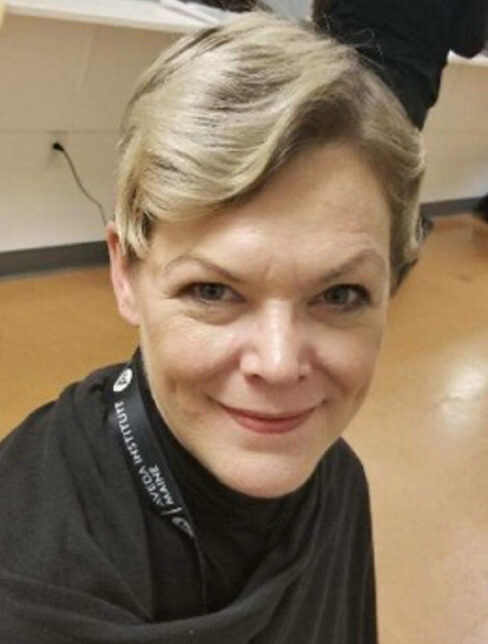 Kimberly Mironovas sits at a station at Aveda Institute Maine, a cosmetology school in Augusta. Mironovas, 47, was found dead early Sunday morning in her Litchfield home. Her son and another boy are charged with murdering her.
