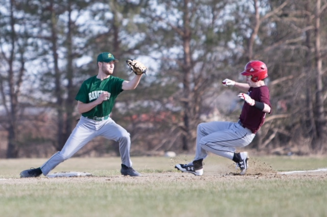 Richmond runner Andrew Vachon slides safely into third base as Rangeley's Cal Crosby tries to make a play during a game Tuesday afternoon at Richmond High School.
